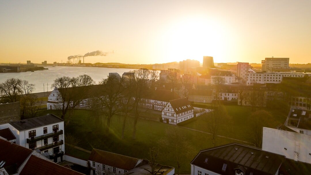 Industrial harbour cranes in Aalborg at sunset